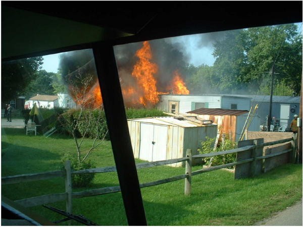 Engine 4 arriving 1st Due at a mobile home fire on Grant Street.